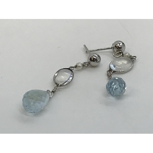 128 - A pair of 14k white gold moonstone and faceted aquamarine drop earrings, stamped 14k