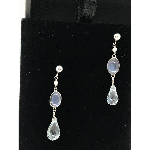 128 - A pair of 14k white gold moonstone and faceted aquamarine drop earrings, stamped 14k