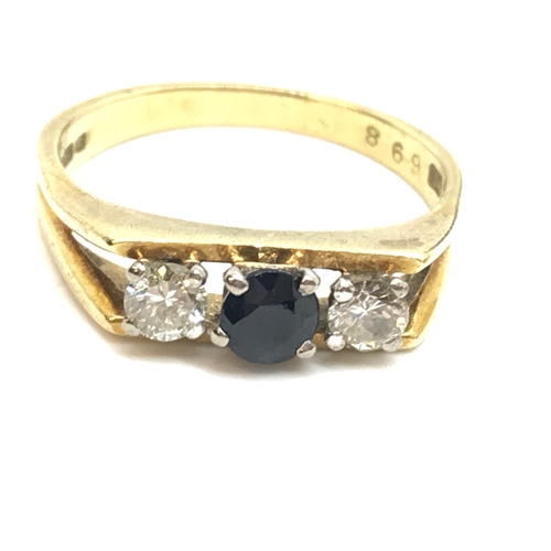 131 - An 18ct yellow gold diamond and sapphire ring in a rectangular bar design, the larger central sapphi... 