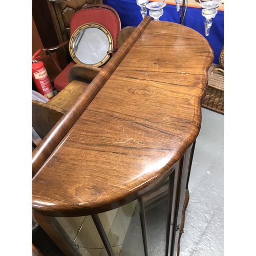 73 - A mid-20th Century display cabinet on raised cabriole legs.  Glazed panels and two Glass Shelves, wi... 