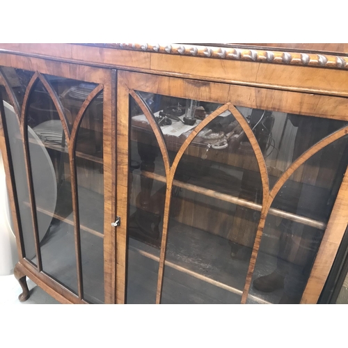 74 - A vintage cabinet with wooden shelving and glass front door panels with wooden trims, NG Exclusive L... 