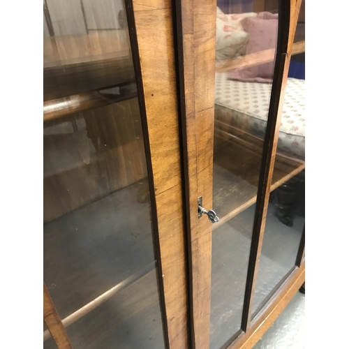 74 - A vintage cabinet with wooden shelving and glass front door panels with wooden trims, NG Exclusive L... 