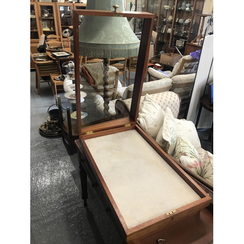 83 - An oak and glass display case with brass handle to side for top opening complete with padlock and ke... 