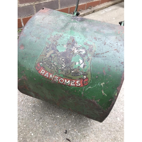 1 - A Ransomes push mower with grass box and wooden handles, stamped plaque reads Anglia 10