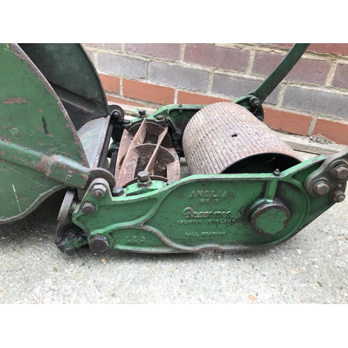 1 - A Ransomes push mower with grass box and wooden handles, stamped plaque reads Anglia 10