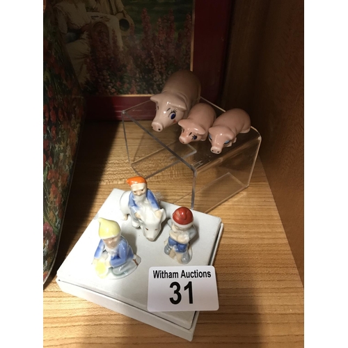 31 - A quantity of Wade figures and other animal figurines including vintage pixies riding piggies, Disne... 