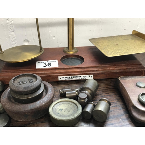 36 - Arnold Precision Post Office Scales with a selection of weights, made in Redhill, Surrey