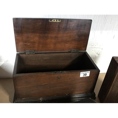 39 - An antique mahogany wooden box with an arch design trim, with a key together with an antique jewelle... 