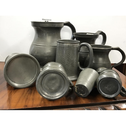 53 - Pewter items including six quarts to half gill graduating pewter jugs, two hammered effect pewter ta... 