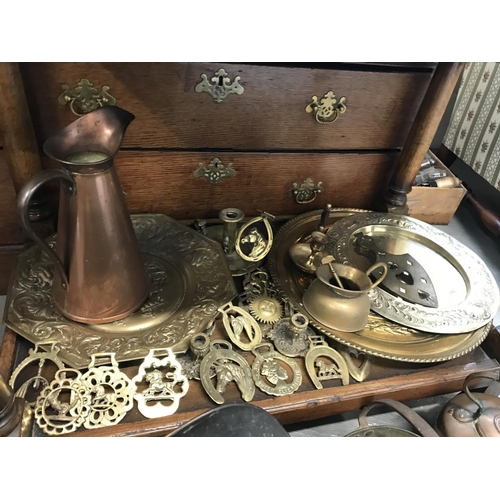 57 - A large quantity of brass and copper items including coal scuttle with handle and shovel, jug, pans ... 