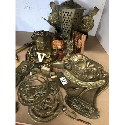 59 - A quantity of brass and copper decorative items including folding pair of comedy and drama book ends... 