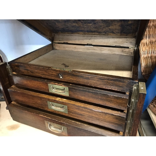 84 - Campaign style oak cutlery/collector's box with wooden trim beading, three drawers, brass trims and ... 