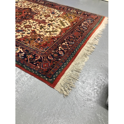 82 - A large rectangular rug with cotton fringe trim of Persian design, approx. size L290cm x W 205cm