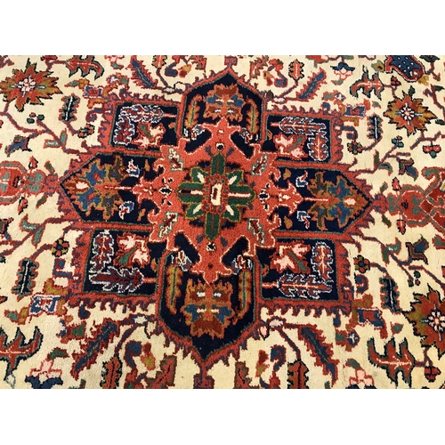 82 - A large rectangular rug with cotton fringe trim of Persian design, approx. size L290cm x W 205cm