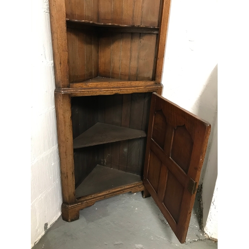 91 - Titchmarsh & Goodwin freestanding corner cupboard, which is in two sections, complete with key