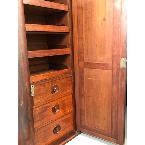 76 - Antique mahogany triple wardrobe linen press compactum. The triple wardrobe being raised on a plinth... 