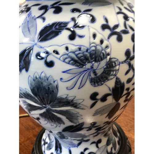 113 - Blue and white Chinese ginger jar lamp on wooden plinth, decorated with butterflies and fauna, PAT t... 