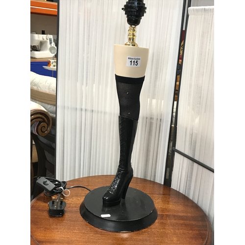 115 - A novelty lamp in the form of a sexy leg dressed in fishnet stocking and heeled knee length boot.   ... 