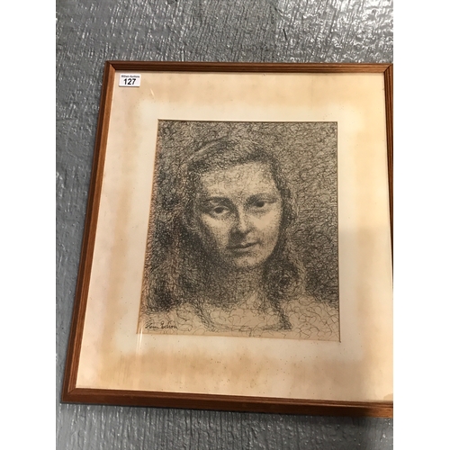 127 - A framed female portrait composed in pen and ink signed by Henri Edion