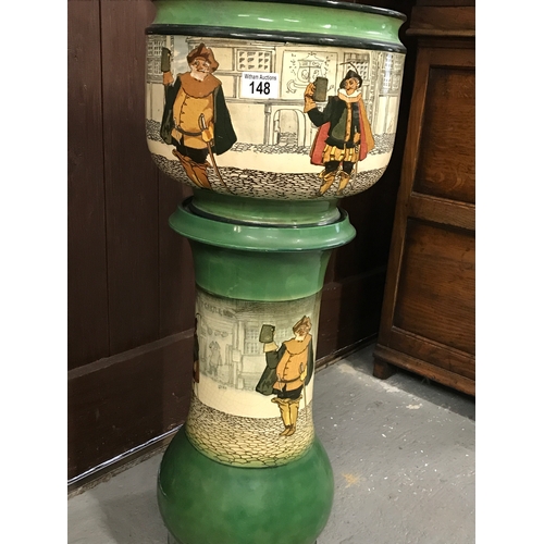 148 - An antique Doulton jardinière bowl and stand decorated with Shakespearean figures stamped D2220 c. 1... 