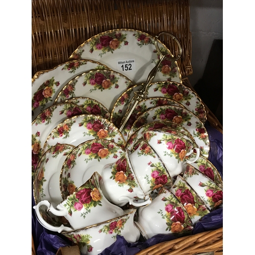 152 - Wicker basket containing Royal Albert Old Country Roses, six cups and saucers, six side plates, a sa... 