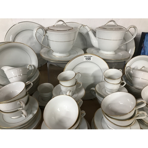 155 - A Noritake 'Guinevere' part tea/dinner set featuring a subtle white scroll detailing with gold trim.... 