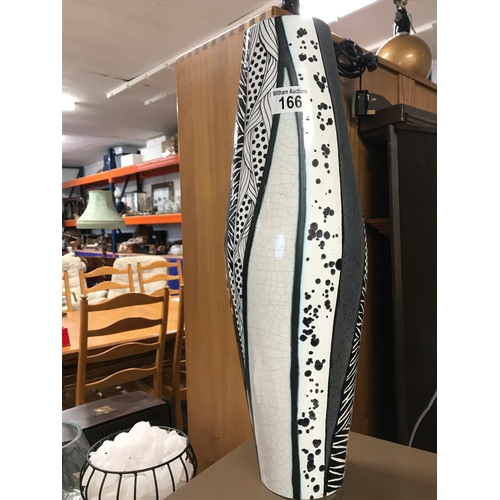 166 - A ceramic textured vase with an animal print inspired design