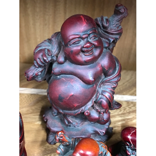 174 - Resin laughing Buddha ornaments in various poses and sizes, Four in total