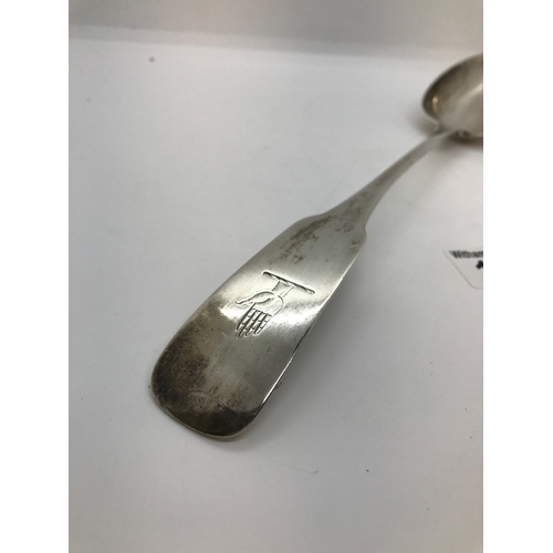 190 - A silver serving spoon with hand motif to handle stamped Corbett Sterling, approx. weight 125g