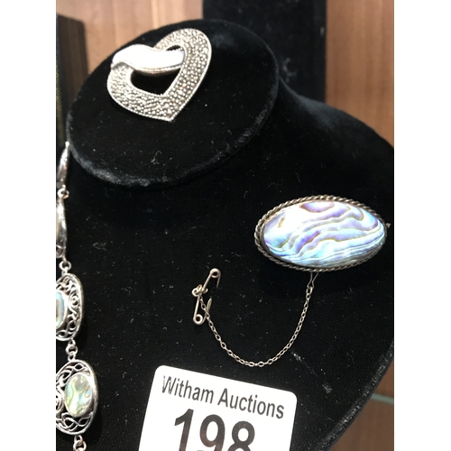 198 - A silver and abalone bracelet stamped PK 925, a silver mother of pearl and marcasite heart shaped br... 