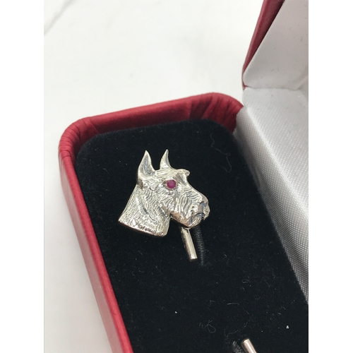 200 - A pair of 'textured' silver dog head cufflinks stamped Sterling