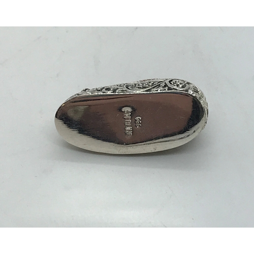 201 - A silver pincushion in the form of a slipper/shoe stamped Sterling 925