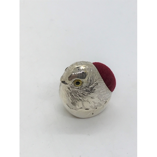 205 - A silver pincushion in the form a chick stamped sterling