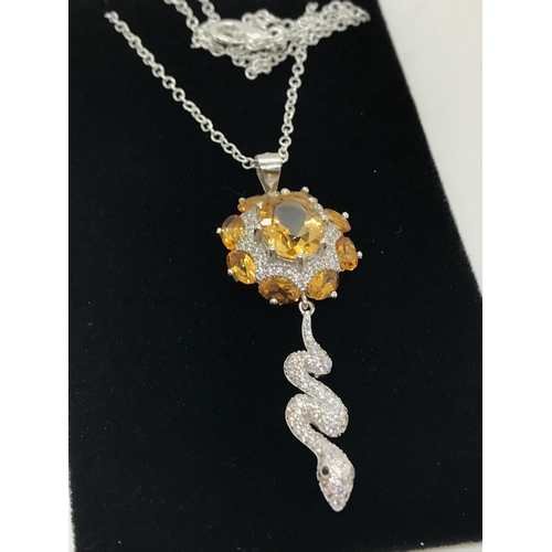 207 - A silver pendant set with citrines and CZ snake drop with chain, chain stamped 925