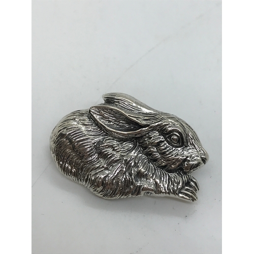 213 - A silver rabbit brooch stamped sterling