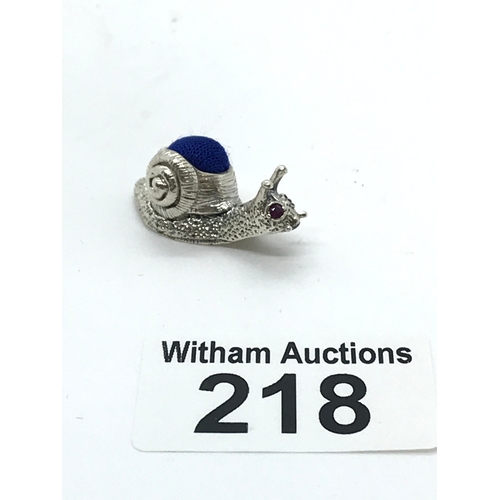 218 - A silver pin cushion in the form of a snail stamped 925