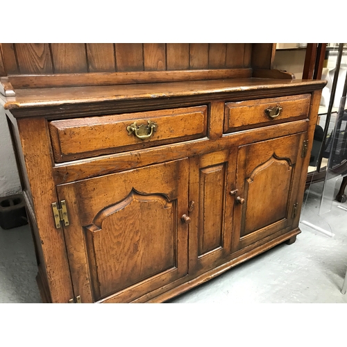 93 - A custom designed piece by Titchmarsh & Goodwin 20th century oak dresser (in two sections)