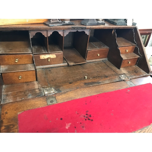 97 - A Georgian bureau with fall front and graduating two over two drawers, on bracket feet, A/F Approx w... 