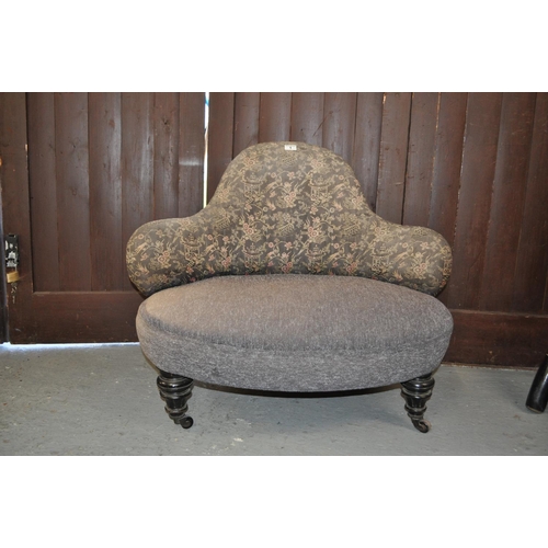 1 - A small Victorian castored chair/sofa with oriental design to fabric