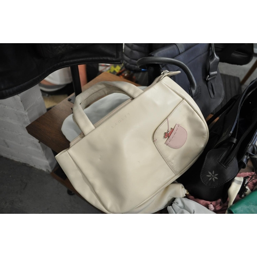 100 - A quantity of Radley handbags with dust bags