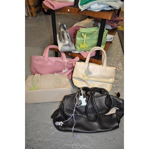 101 - A quantity of Radley handbags with dust bags