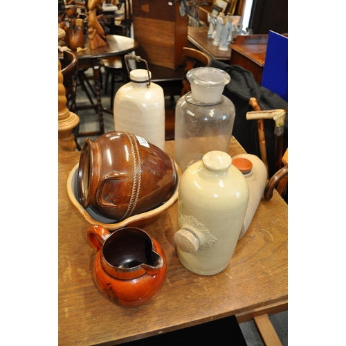 108 - Stoneware items including hot water bottles, mixing bowl and pot etc