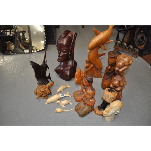 113 - A selection of  tribal themed wooden carved figures and animals etc.