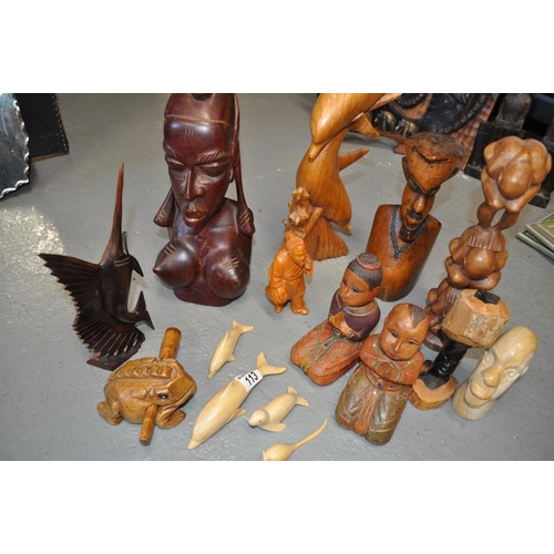 113 - A selection of  tribal themed wooden carved figures and animals etc.