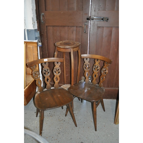 116 - A two -tier plant stand and two Ercol Fleur de Lys chairs