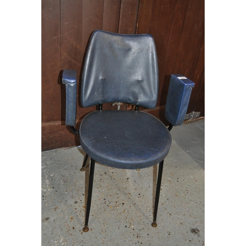 120 - A retro chair with splayed legs and upturned arm rest design