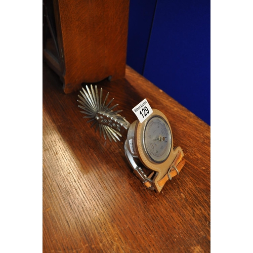 129 - A novelty desk Barometer with cowboy spur, marked Shortlands SB