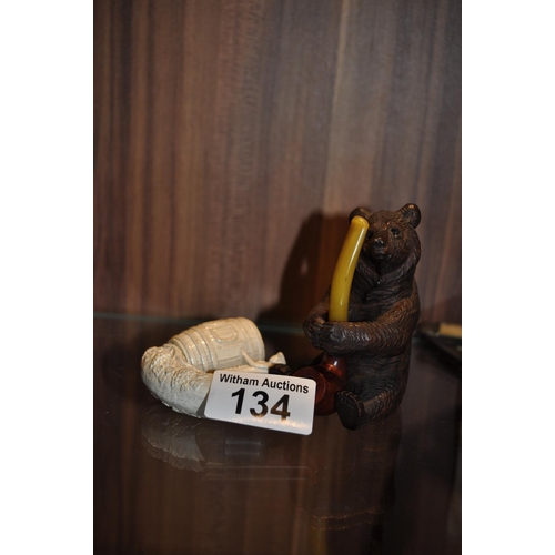 134 - Vintage Black Forest Bear A/F holding a pipe together with a novelty clay pipe (Double Diamond)