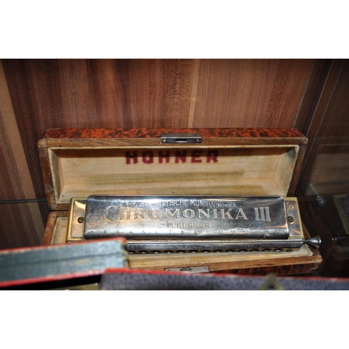 138 - Three Hohner harmonicas in boxes, including a Chromonika III model