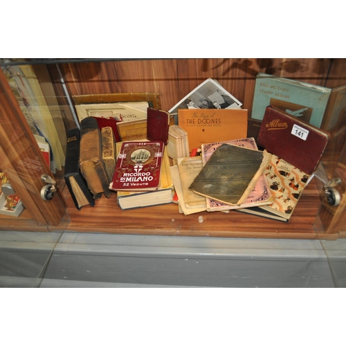 141 - A selection of antique and vintage bibles, stamp album and other ephemera items